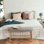 How to Choose the Right Furniture to Decorate Your Home. Light bedroom rustic interior with natural materials. Wooden furniture and cotton textiles.