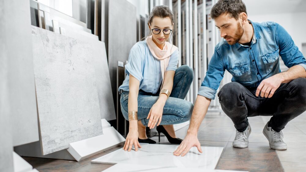 Couple choosing tiles in the shop